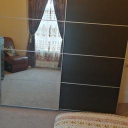 Ikea double sliding doors wardrobe. Both sides hanging rails one side 3draws and other side basket draws both side shelves. Bought last year selling due to move the house. Excellent condition