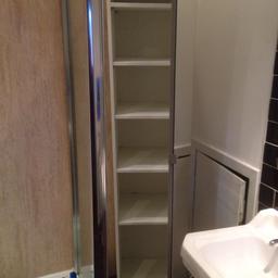 IKEA freestanding bathroom cabinet, approximately 6ft tall and has 5 shelves which are adjustable. The door has a full length mirror on the outside.