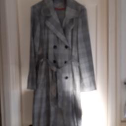 Double-breasted dress coat, below knee with belt. Can be posted or collected.