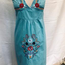 Turquoise embroidered cotton summer dress sizeUK 12 mid length
Worn but in good clean condition