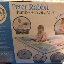 Peter Rabbit activity mat very good clean condition includes mirror and textured parts of the mat. Great for putting on a hard floor. In original box.