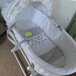 Moses basket along with its stand, can rock side to side. Comes with matching set if wanted.