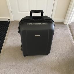 Stylish large black suitcase. Only used a few times and in great condition. Has keys and combination lock for added security.