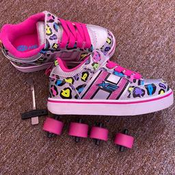 UK size 12 Multicolour cheetah X2 lightup heelys. Like new, never been used! As you can tell from the pictures. Comes with everything including the box.

The H on the size lights up.

Collection only.. smoke free home