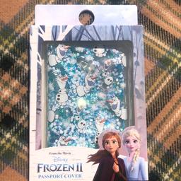 Unused- still sealed 

Disney frozen passport cover - filled with confetti