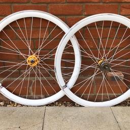 White and gold fixed gear wheels.

From a large framed fixie, see pics for measurements from rim to rim. 25 inches