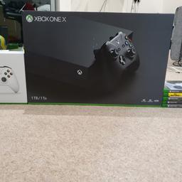 Here we have a brand new X-Box One X 1TB
With five games boxed and a controller.