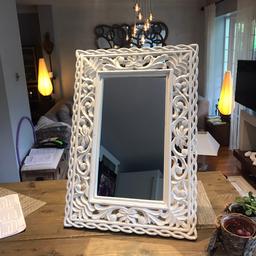 A brand new mirror, with a white ,wooden frame that could also be used as a picture frame.
The mirror also has a stand at the back.
Dimension:

Frame 
Height-65
Width-45

Mirror
Height-43
Width-24cm