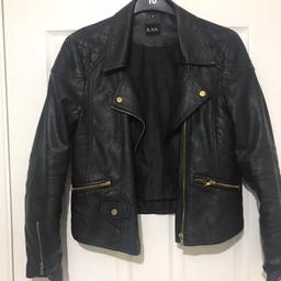 Black leather jacket with gold features. I love this jacket however it’s got to bit for me so it looks a bit stupid being baggy :( I’ve ordered the next size down!! This is a size 12! Really comfy, not a stiff jacket.