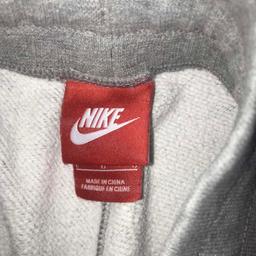 Grey Nike tracksuit bottoms, cuffed. Good condition. Size large