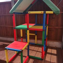 A beautiful solid climbing frame house which my five and ten year old still love to this day.

This is a German brand and is very expensive, you can buy a new fabric roof as this one is very worn due to two full summer and winter wear. They are £30 on the QuaDro website. This Frame cost over £300 two years ago and I am really reluctant to sell but due to small garden something has to give. This can be made into different shapes all interlocking. Collection B38 Kings Norton