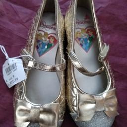 NEW with tags Disney Princess Glittery Shoes Size UK 8.5.  Forgot about them and now small. Skid resistant. Perfect new condition.

Postage available for an extra fee of £3.10