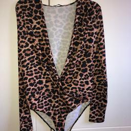 Never worn, stunning leopard print, low - cut body suit from Zara.
Women’s medium