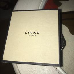 Links of London ladies brand new unworn silver charm bracelet with 5 charms included