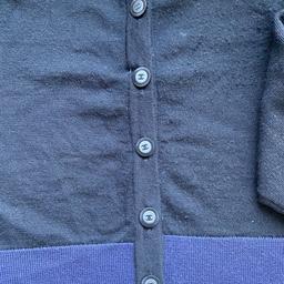 Black and navy wool cardigan. Label cut off on the outside. Staff Uniform.