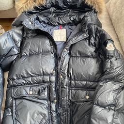 MONCLER navy blue coat with fur used condition does a a rip an a small tear this can be sewn see last 2 pics lovely coat
 Is a age 10 but MONCLER small fittings would do a age 7/8