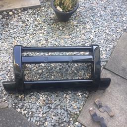 Front bumper nudge bull bar section in shiny gloss black. Simply bolts over your original bumper to beef up and modernise the look all brackets supplied. 2002 to 2006 models collection only no post