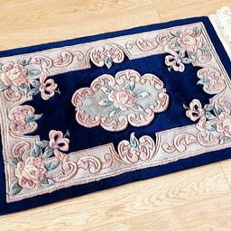 Oriental rug in navy blue with pattern in shades of dusky pink, lilac and sage green
A good quality, heavy mat from a smoke-free home with no pets or kids
Size approx 46" x 24" (117 x 61cm)