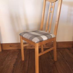 4 Dining room chairs, light wood, good condition but has a little wear and tear. (But nothing major) New seat covers not long been on.