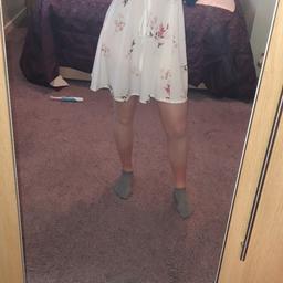 White flowery flowy dress. Light material so good for the Summer. Hardly worn so very good condition.