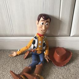 A well loved Woody. In good condition, with clear working voice box.