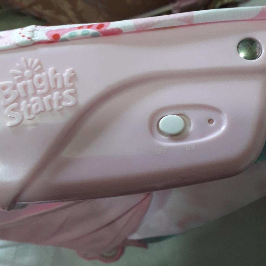 GENTLE VIBRATING. REMOVABLE TOY BAR WITH INTERACTIVE TOYS. FEATURES A CRADLING SEAT DESIGN. 3 POINT SAFETY HARNESS. NON SLIP FEET. MACHINE WASHABLE. THE PRETTY IN PINK COLLECTION. A PORTION OF THE PROCEEDS GO TOWARDS BREAST CANCER RESEARCH AND AWARENESS.