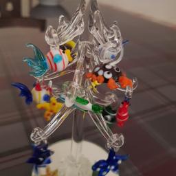 Brand new item has just been in a closed display cabinet for about 4 months only touched once so basically brand new. cute and unusual christmas tree/ tree with hanging glass fish ornaments. high quality glass and a perfect talking piece/ table centrepiece/ display inside a fish tank or gift for any fish lover. Open to a decent offer and available for collection or delivery/ postage