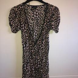 Low cut leopard print dress. 
Worn a few times, still good condition. 
Topshop, women’s size 8