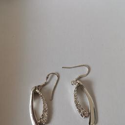 Silver colour earrings for pierced ears are diamonte collection only
