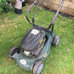 Power Force/Tesco petrol mower 99cc.  Has run last year. With grass collector.