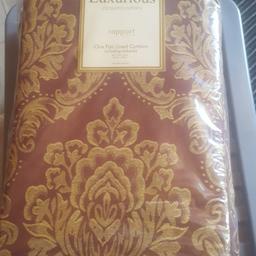 lovely lined jacquard curtains in a chocolate brown colour 90 by 90 brand new still in packaging with tie backs