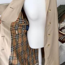 Stunning vintage Burberry trench 
Pristine condition! 
Size 12 
Nice check lining! 
Looks almost new. Does have one mark at the very bottom of coat by hem that will dry clean out. 
No offers please as I was asking £199 for this jacket and have marked it down. Thanks for looking