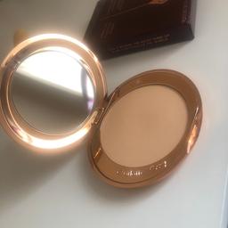 Charlotte tilbury airbrush flawless finish micro powder. Shade medium 2. Used a couple times as shown in the images. Good condition and comes with packaging.  Can collect or post for a fee. RRP £35