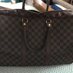 This has no information to indicate if authentic. I inherited this a year ago. I am therefore selling as a LV style and priced to sell. It's in lovely no rips or tears and in clean condition. Ideal for weekend breaks/cabin luggage.
Open to offers