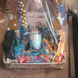 all made to order

-beer glass, deondeant, shower gel, 2 beers, socks, pork scratchings, fathers day card, slab of chocolate, toblerone along with mini dairy milks, lidnt balls and eggs, daim bars. all comes giftwrapped with a bow and ribbon. also the basket wrapped is a reusable basket very handy!

(one side will not be wrapped so you can take the fathers day card out and write yourselves)
