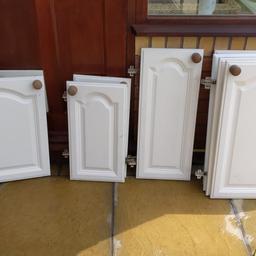 Solid wooden doors and drawers, painted cream with wooden knobs.

What's included:-

714mm approx height doors =
7 x 500mm
1 x 400mm
1 x 300mm

554mm approx height doors =
2 x 300mm
1 x 500mm

Drawers =
2 x 300mm
1 x 500mm

Some doors could do with a re-paint.