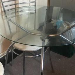 Glad top table and 4 chairs in good condition.chairs could do with a clean,they are fabric.was being held for someone but they didn’t come through so back up for sale! Collection only.