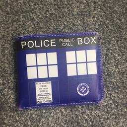 A wallet with an exterior that looks like the TARDIS. It is in great condition and has not been used.