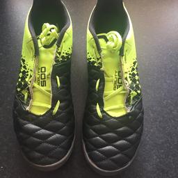 Agility 500 football boots by Kipsta in a UK size 8, designed for firm ground and AstroTurf, as it has rubber studs rather than plastic or metal. Worn, but no longer fit. Good condition.