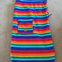 Warm and snug footmuff by Buggy Snuggie. Bright rainbow coloured stripes. Excellent condition