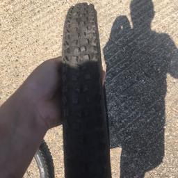 One continental tyre fairly worn and one continental mountain king like new  tyre both 29 inch