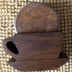 In excellent condition,wooden digestive biscuits coasters set of 4 in stand