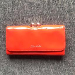 Neon orange purse. 
Holds 12 credit cards. 
Section for notes 
Back zipped coin section.
Has been used but in excellent condition. 
Happy to post out.