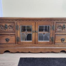 Dark wood old charm tv cabinet with 4 draws and 2 internal shelves with door cover. One owner, good condition. W 112cm x D 46cm x Ht 52cm. each draw 22cm width.