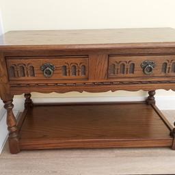 Dark wood old charm coffee table with 2 drawers that are accessible from both sides. W 92cm x D 46cm x Ht 51 cm. The draws are 32cm width.