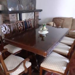 This beautiful table and chairs are in immaculate condition there are two carver chairs and six without arms they are covered in a gold fabric the table extends and it’s all in beautiful condition
