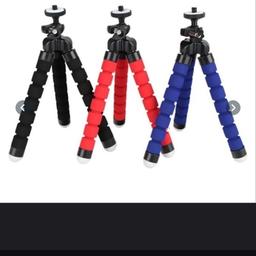 Product Features:
Color:Black,Blue,Red
Size:pls see the picture
Weight about 60g
Material:ABS
Pack With Remote Control:1 * Phone Tables Holder,and 1*Remote Control
Cell Phone/Camera Holder:
It allows you to attach your phone to a monopod or tripod for better quality picture.