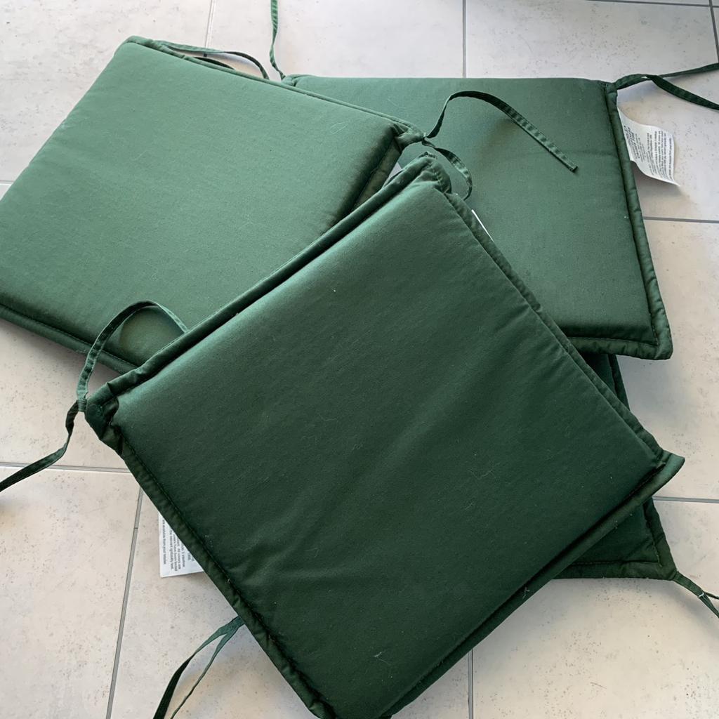 Four green outdoor chair seat pads in Grappenhall for £10.00 for sale