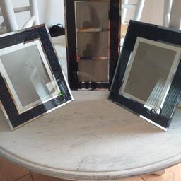 set of 3 black sparkle picture frames, excellent condition , tall picture still wet in the back ground as ive wiped over them.