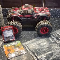hpi savage XS flux RTR stupidity quick ready to go with 3S lipo and charger spare wheels and upgraded gear.